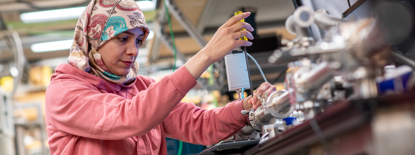 Woman wearing hijab working in a science lab