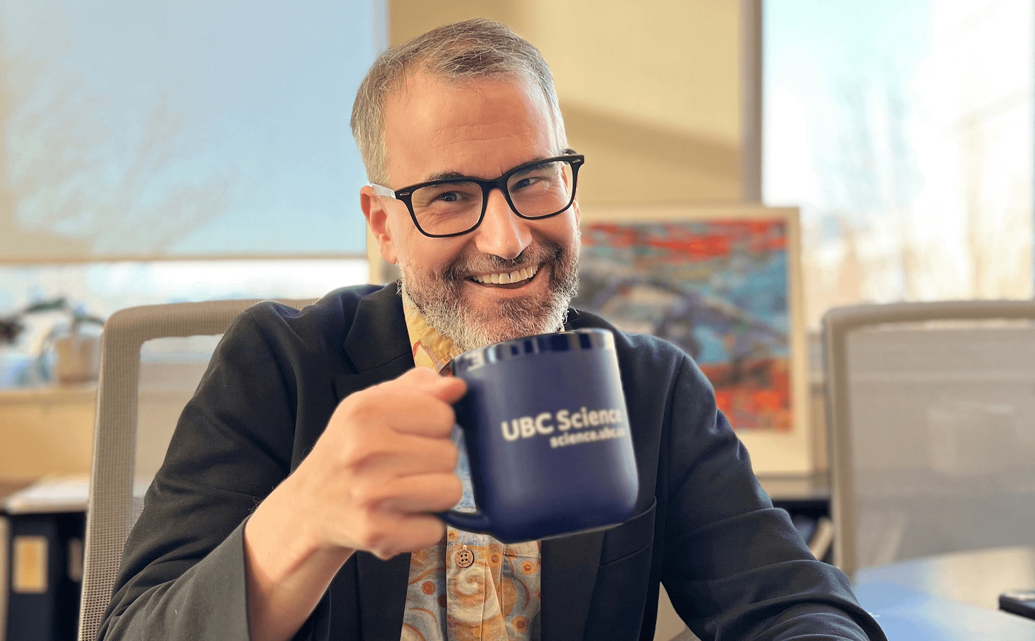 The Dean of Science Mark MacLachlan holding a coffee mug