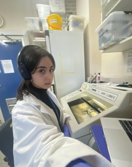 Carina Fota in the lab wearing a white lab coat