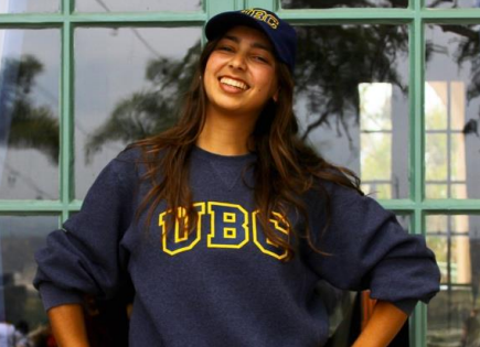 Gabriella Mallios wears a navy UBC sweater