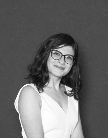 Kiana Pashaoskooie wears glasses and a white top