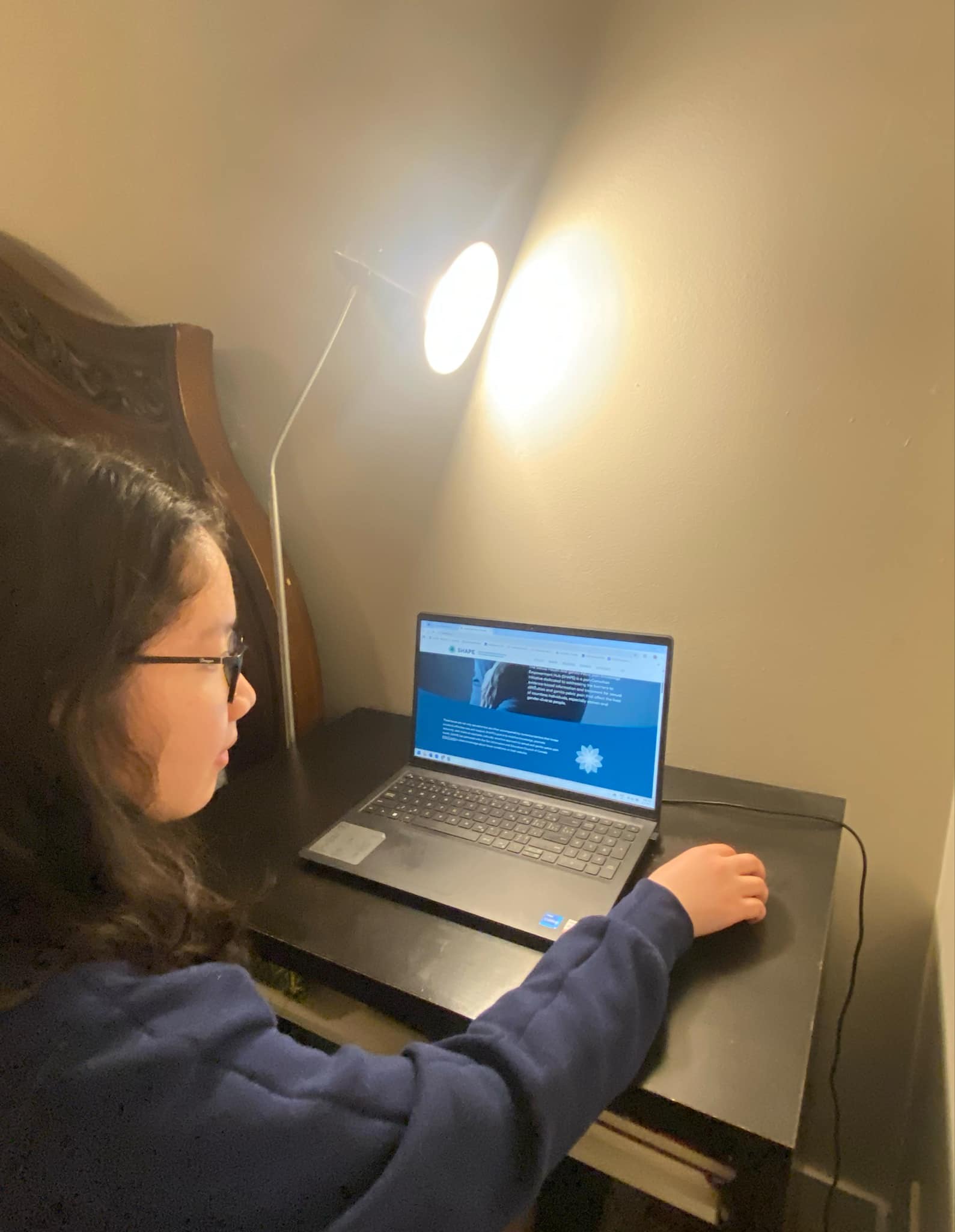 Vicky Nguyen works in front of a laptop