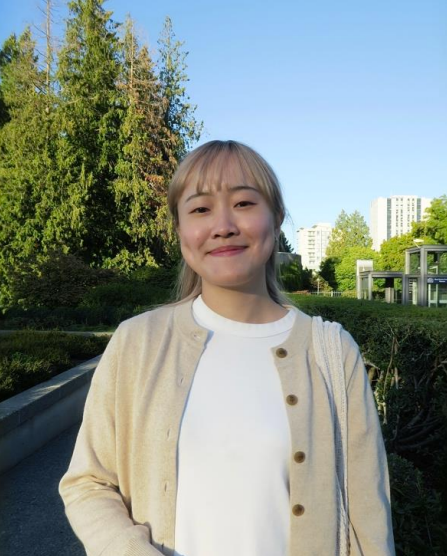 Yuka Ohno wears a beige sweater and has blonde hair