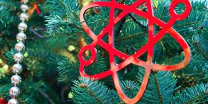 An atom orniment on a tree.