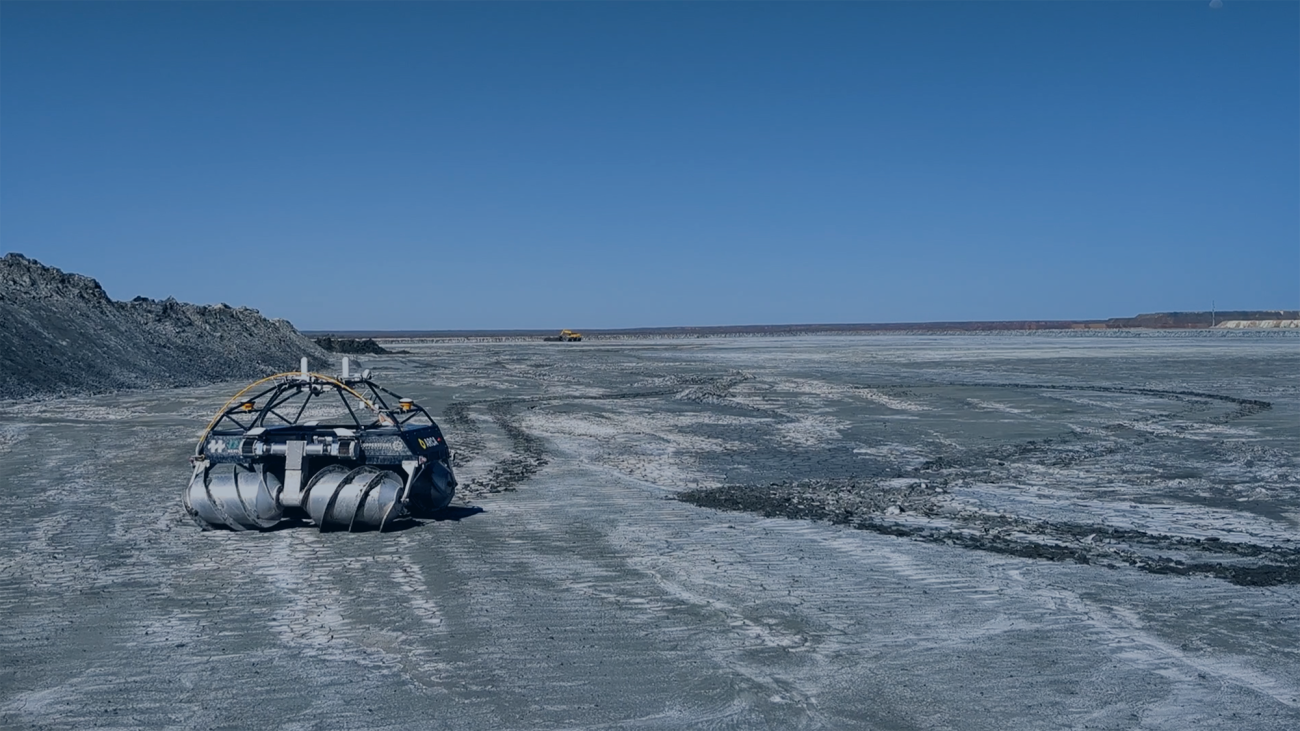 An autonomous rover on a mine tailings field.