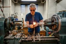 Brian Ditchburn blowing glass in his lab at UBC.