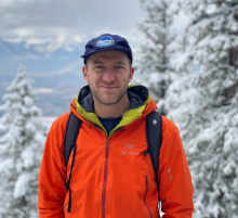 Dr. Graham McDowell standing on a snowy mountainside