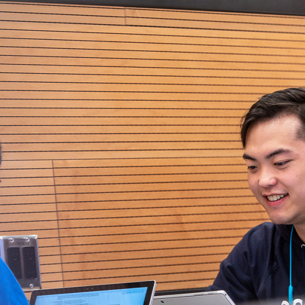 Two students studying at a desk